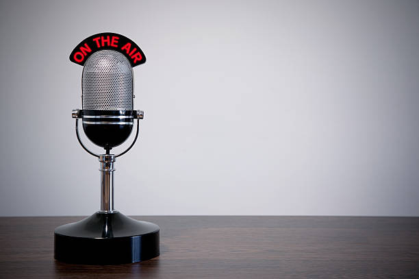 istock Retro desk microphone with red wording and gray background 104765753