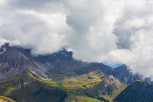 istock Dramatic cloudscape and rain clouds in the Dolomite Mountains, Italy 1047657900