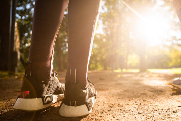 istock Close up of en athletes trainers running. 1047661604