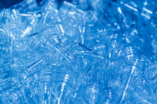 istock The preform shape of PET bottle for blowing plastic bottle process in the light blue scene. 1047661622