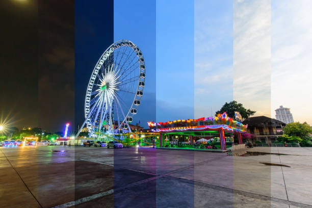 Different shade color Ferris wheel at amusement park in sunset time