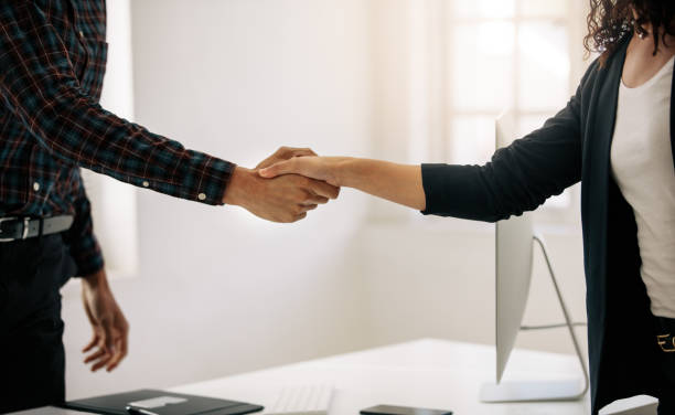 istock Business partners shaking hands at a meeting 1047662406
