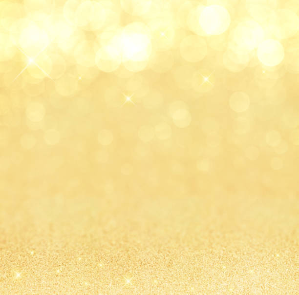 istock Beautiful gold background with sparkling glitter and bokeh light 1047665084