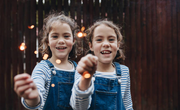 istock Girls joyfully holding sparklers 1047668422