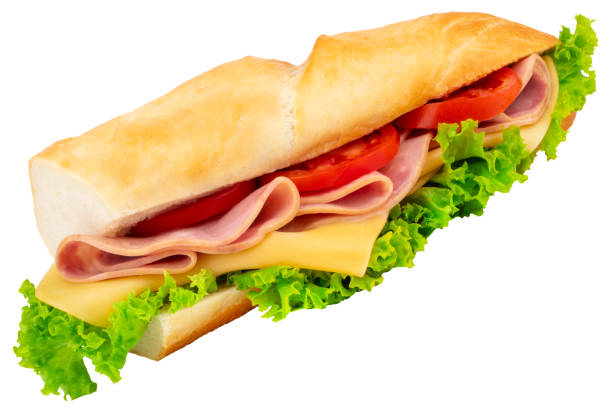 istock Fresh baguette sandwich with ham, cheese, tomatoes, and lettuce isolated on white background 1047668448