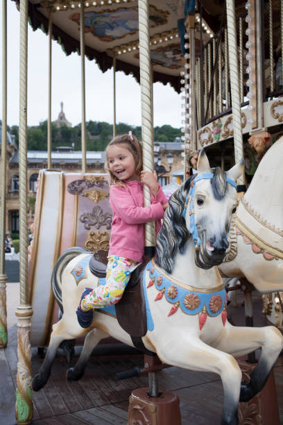 istock child on the carrousel 1047672170