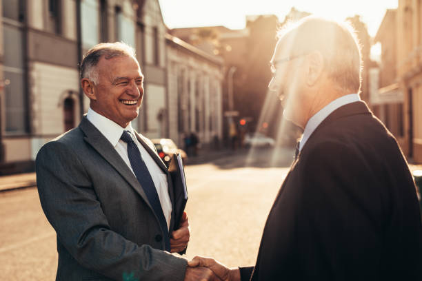 istock Senior business men greeting with a handshake 1047672560