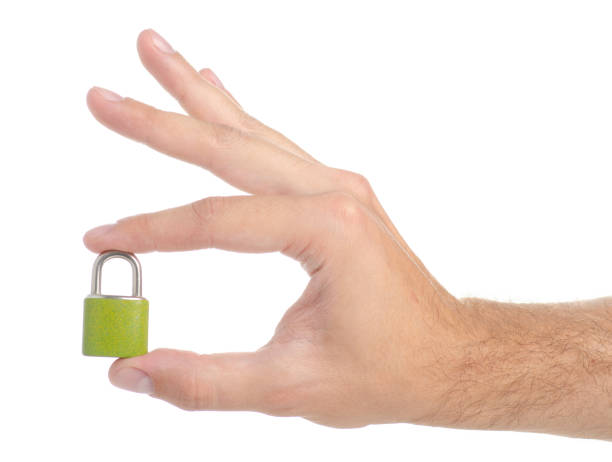 istock Small padlock metal in hand 1047672604