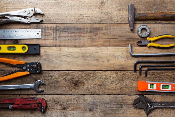 istock Old tools equipment with blackboard on wood table background, engineering concept 1047673426