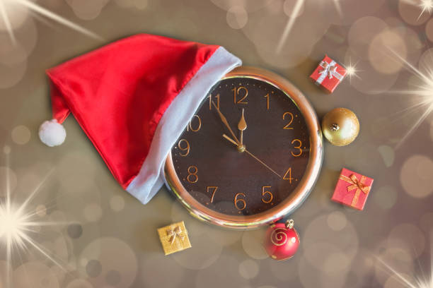istock Clock, Santa hat, gifts and christmas decorations 1047673830