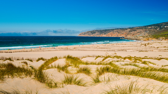 Praia do Guincho is a popular Atlantic beach located on Portugal's Estoril coast, 5km from the town of Cascais, Portugal