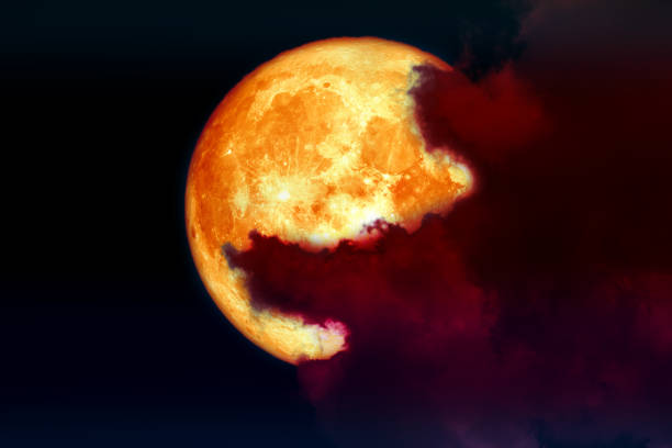 istock super full blood moon back over silhouette cloud night sky 1047677694