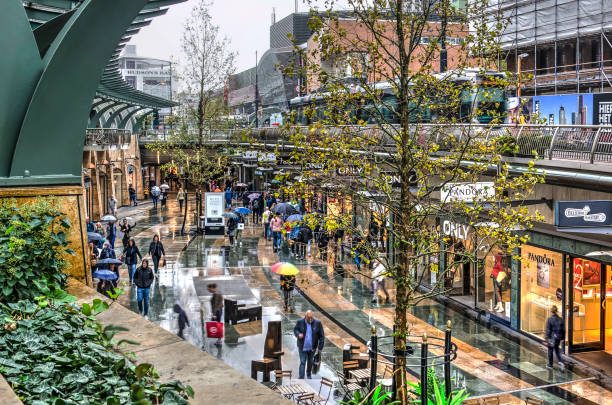 Rotterdam, The Netherlands, September 22, 2018: Shoppers are walking through Koopgoot shopping mall on a rainy day