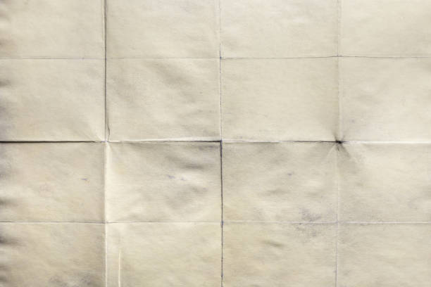 istock Blank surface, old paper sheet with creases 1047680848