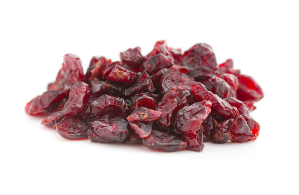istock Tasty dried cranberries isolated on white background. 1047681014