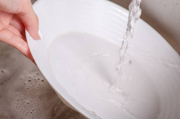 istock Sponge for washing dishes dish in hands washing 1047684476