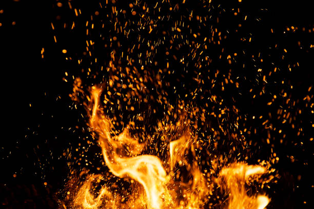 istock Fire sparks with flames on black background 1047684692