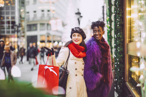 istock Friends are buying Christmas presents 1047684838