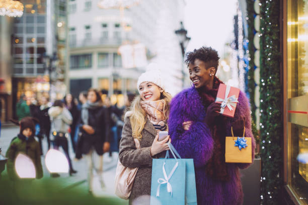 istock Friends are buying Christmas presents 1047684890