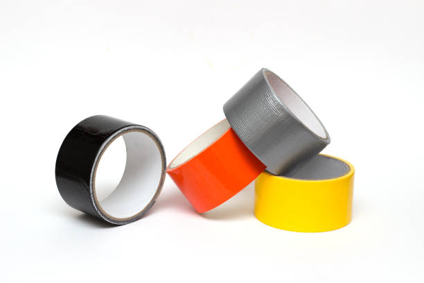 istock colorful tape rolls background on white. Adhesive tape on a white background. 1047684924
