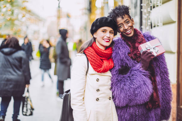 istock Friends are buying Christmas presents 1047685230