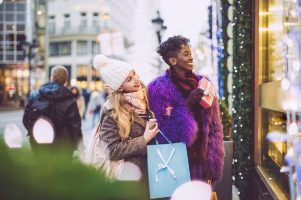 istock Friends are buying Christmas presents 1047685366