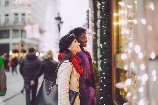 istock Friends are buying Christmas presents 1047689710