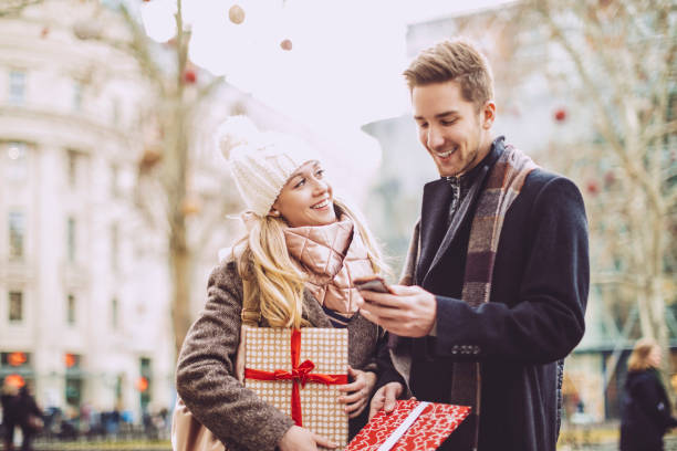 istock Young couple is buying Christmas presents 1047689786