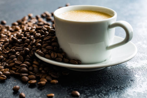 istock Hot coffee cappuccino and coffee beans 1047690042