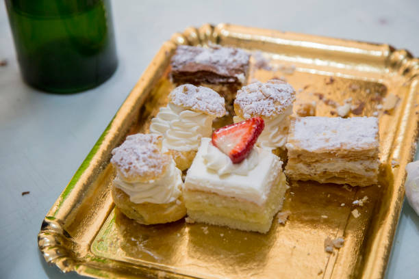 istock image of a golden cardboard tray with mixed pastries 1047693314