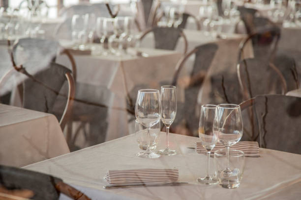 istock image of a group of glass glasses on a restaurant table 1047693408