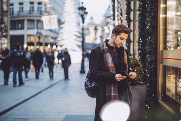 istock Young man is buying Christmas presents 1047693764
