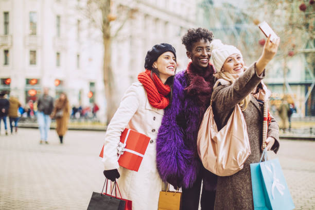 istock Friends are taking a selfies with Christmas presents 1047694304