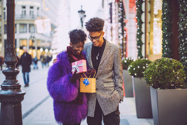 istock Young couple is buying Christmas presents 1047694514
