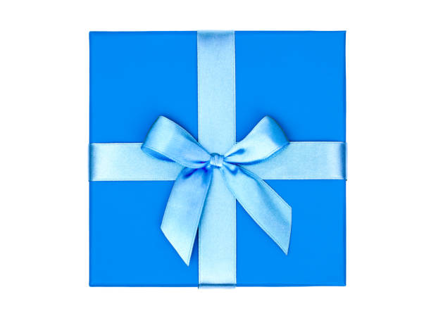istock Top view of blue box with a gift and bow isolated on white background 1047699986