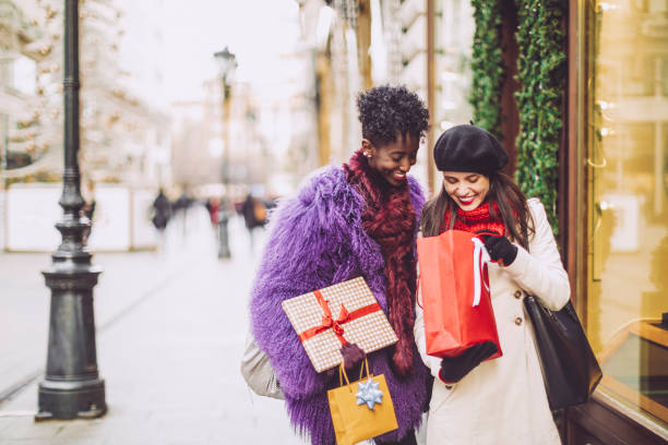 istock Friends are buying Christmas presents 1047700408