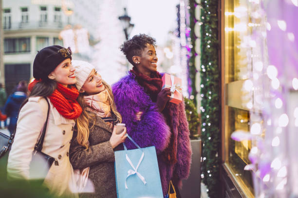 istock Friends are buying Christmas presents 1047702974