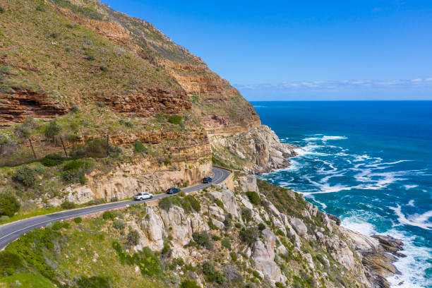 Aerial view of cars in Chapman's Peak Drive Aerial view of cars in Chapman's Peak Drive, Cape Town, South Africa chapmans peak drive stock pictures, royalty-free photos & images