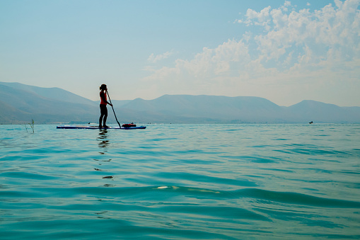 Along with all the motorized watersports that happen on Bear Lake, there is also a lot of paddleboarding and kayaking.  This shot shows a woman paddleboarding just off the North Shore beach area of the lake.  This was still fairly early in the morning so the very blue water was quite calm.  Taken with a camera inside a waterproof case so I could get a very low angle to the water.