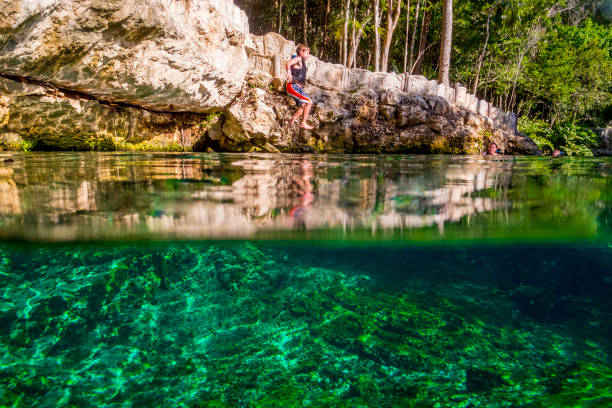 Jumping In Tortuga Cenote stock photo