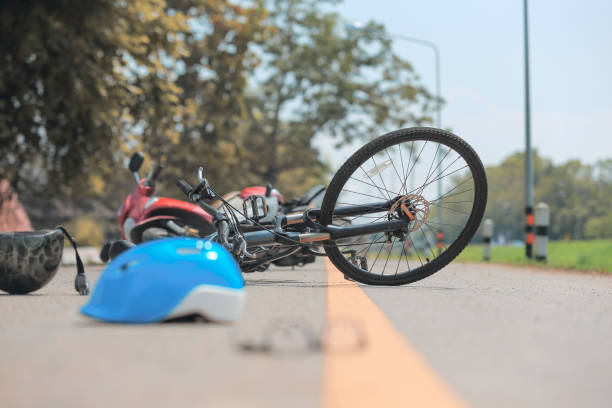 istock Accident motorcycle crash with bicycle on road 1047711596
