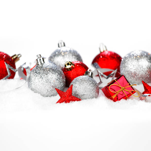 istock Christmas card with beautiful red and silver decorations in snow 1047712172