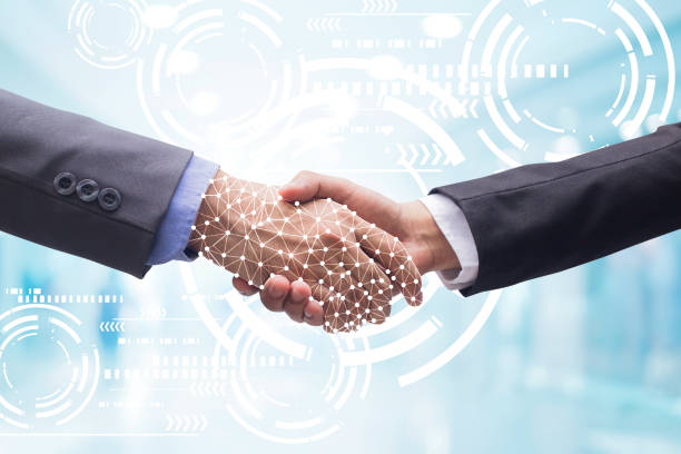 istock close up business man handshake with business artificial intelligence (AI) on motion blur background with virtual interface hologram programming for future technology concept 1047714860