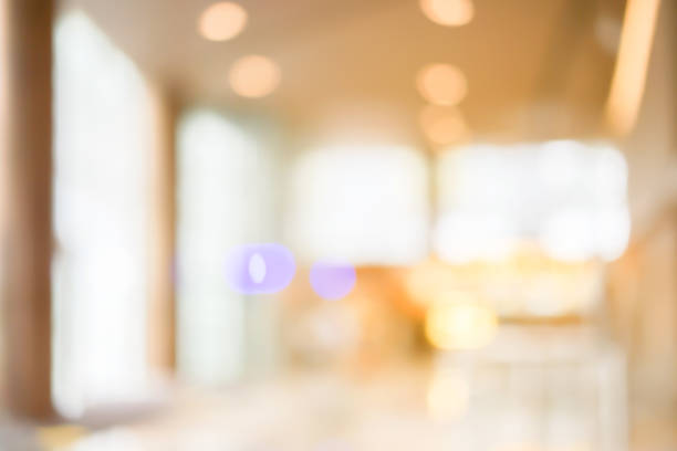 istock blurred shopping mall in light warm tone with bokeh light background 1047715794