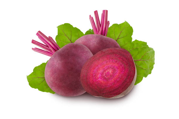 istock Beet root isolated. Two raw ripe red beets and a slice isolated on a white background with green leaves. 1047715910