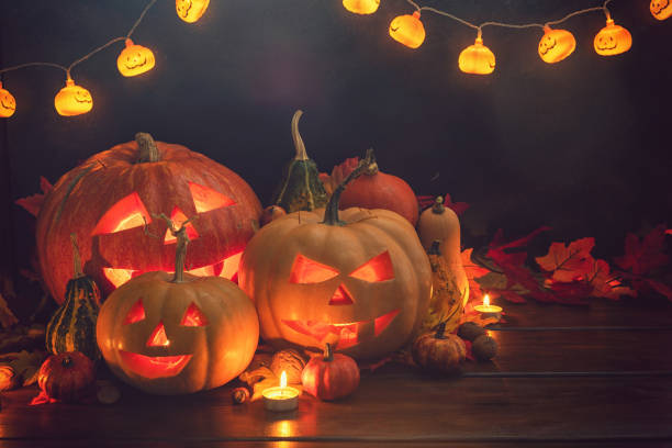 istock Jack O’ Lanterns on The Old Wooden Background 1047716060