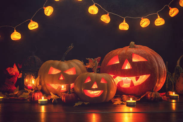 istock Jack O’ Lanterns on The Old Wooden Background 1047718622