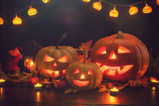 istock Jack O’ Lanterns on The Old Wooden Background 1047718634