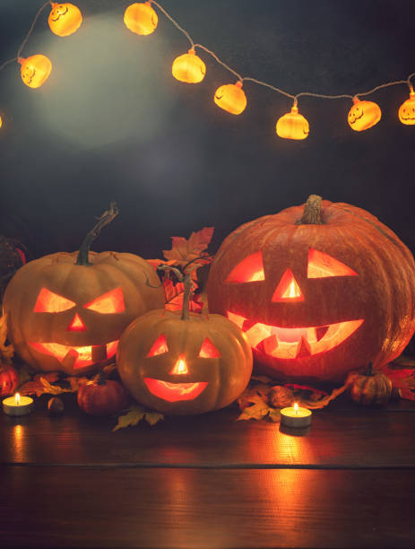 istock Jack O’ Lanterns on The Old Wooden Background 1047718682