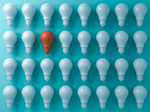 istock Think different concept One orange light bulb standing out from the white light bulbs on blue pastel color  wall background leadership and individuality creative idea concepts 3D rendering 1047719634